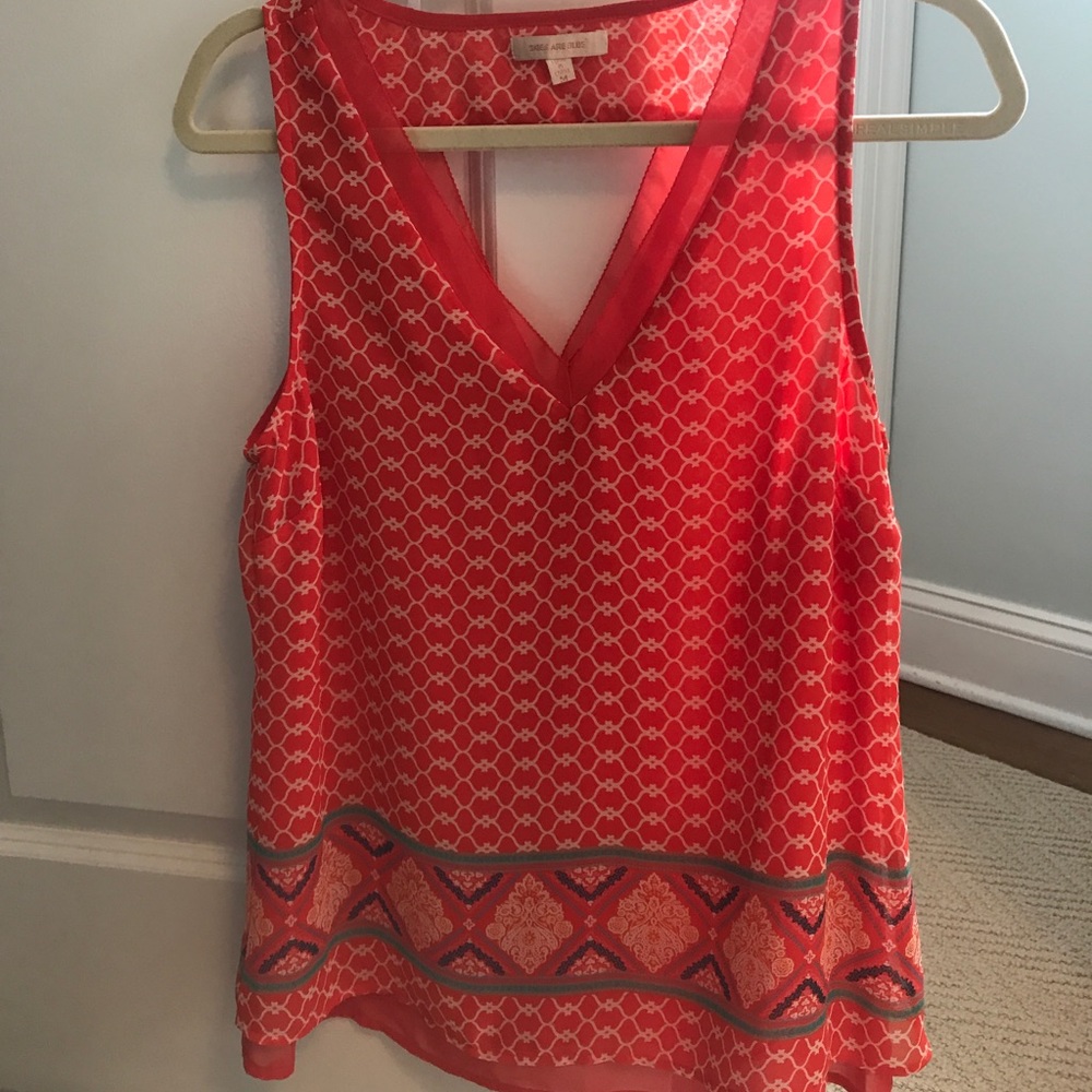Women’s colorful blouse tank top. Skies are blue